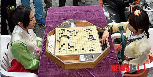 韩国为何规定将死子放入棋盒盖，传统与竞技精神的融合